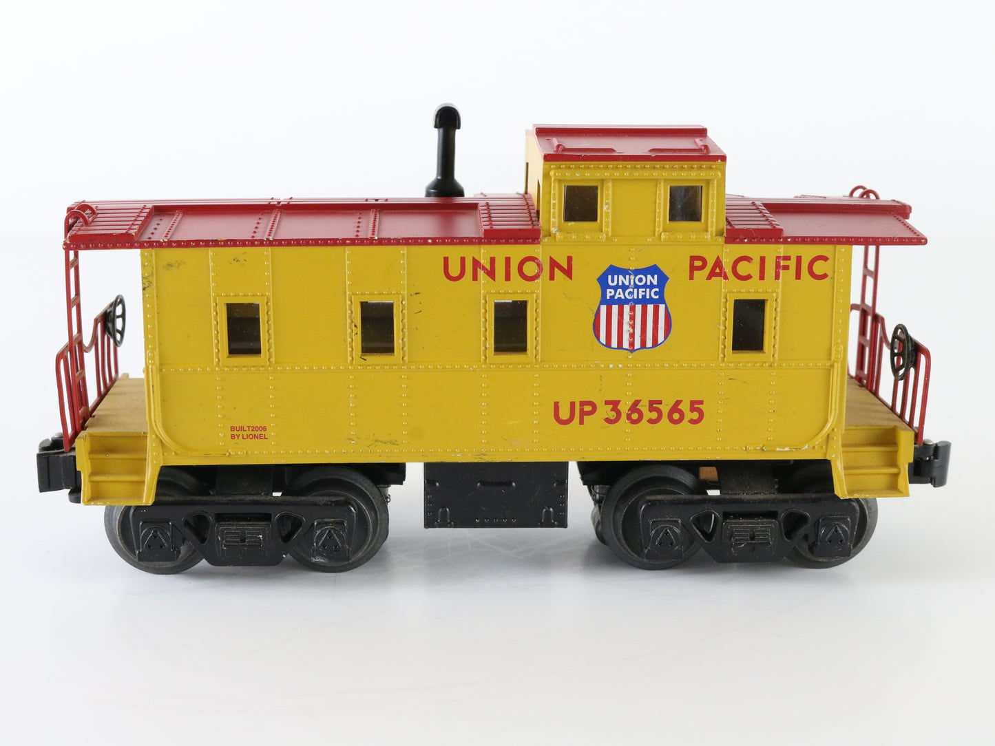 Lionel O Union Pacific UP 36565 Yellow Illuminated Caboose Car – Lionel O scale Union Pacific yellow illuminated caboose car for model railroad layouts.