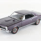 A purple die-cast model car of a classic muscle car, photographed on a clean white background.