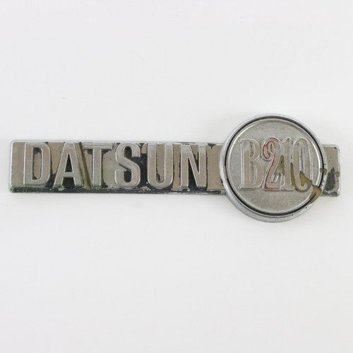  1970s Datsun B210 Silver & Black Plastic Emblem Badge 6.25"