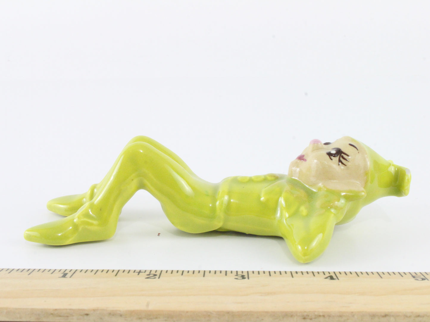 Vintage Pixie Reclining In Green Suit W/ Hat Ceramic 5.5 In